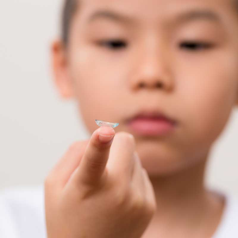 Asian Child with Myopia Contacts